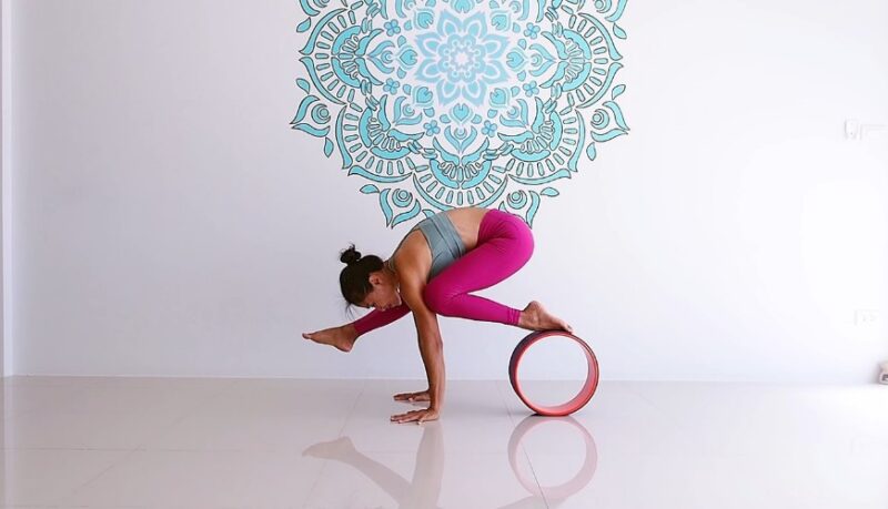 Strength building with yoga wheel